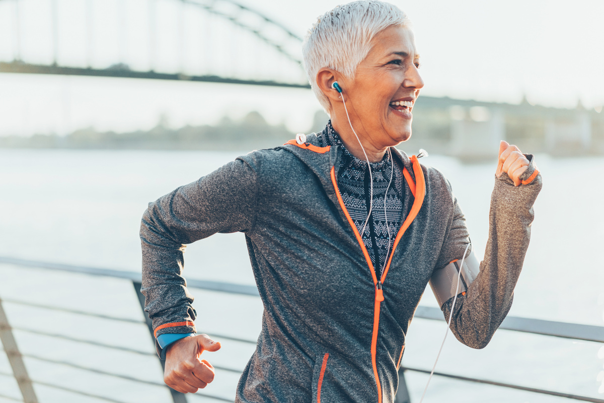 Athletic senior woman running